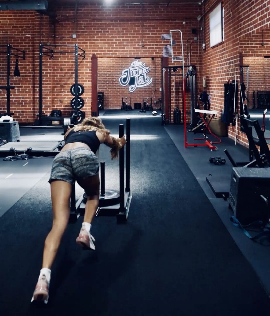 A woman is working out in the gym